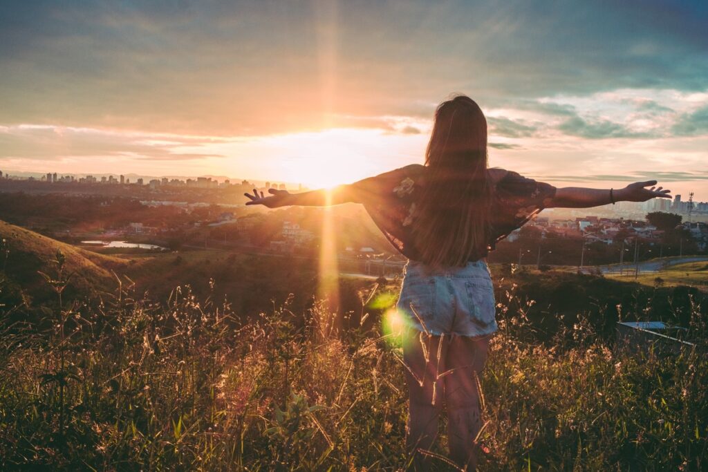 Solo Travel to Lisbon: Ignite Your Adventurous Journey 6 Woman Arms Apart Sunset