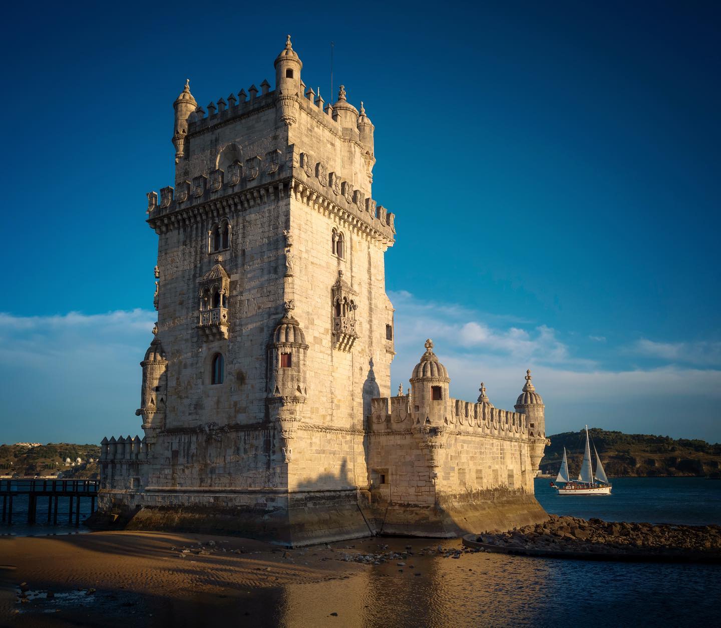 Historic Belém Tower in Lisbon, Portugal, showcasing its iconic medieval architecture along the Tagus River, a must-visit landmark for travelers exploring Lisbon's rich history and scenic views.