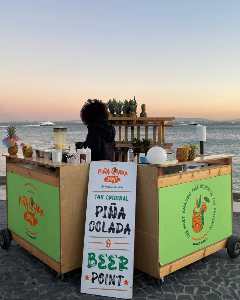 selling drinks at Avenida Ribeira das Naus