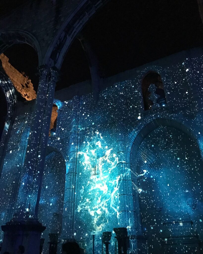 Lisbon in May - Less Crowded? (Perfect Time To Visit) 5 Bright stars and cosmic visuals inside a historic Lisbon church.