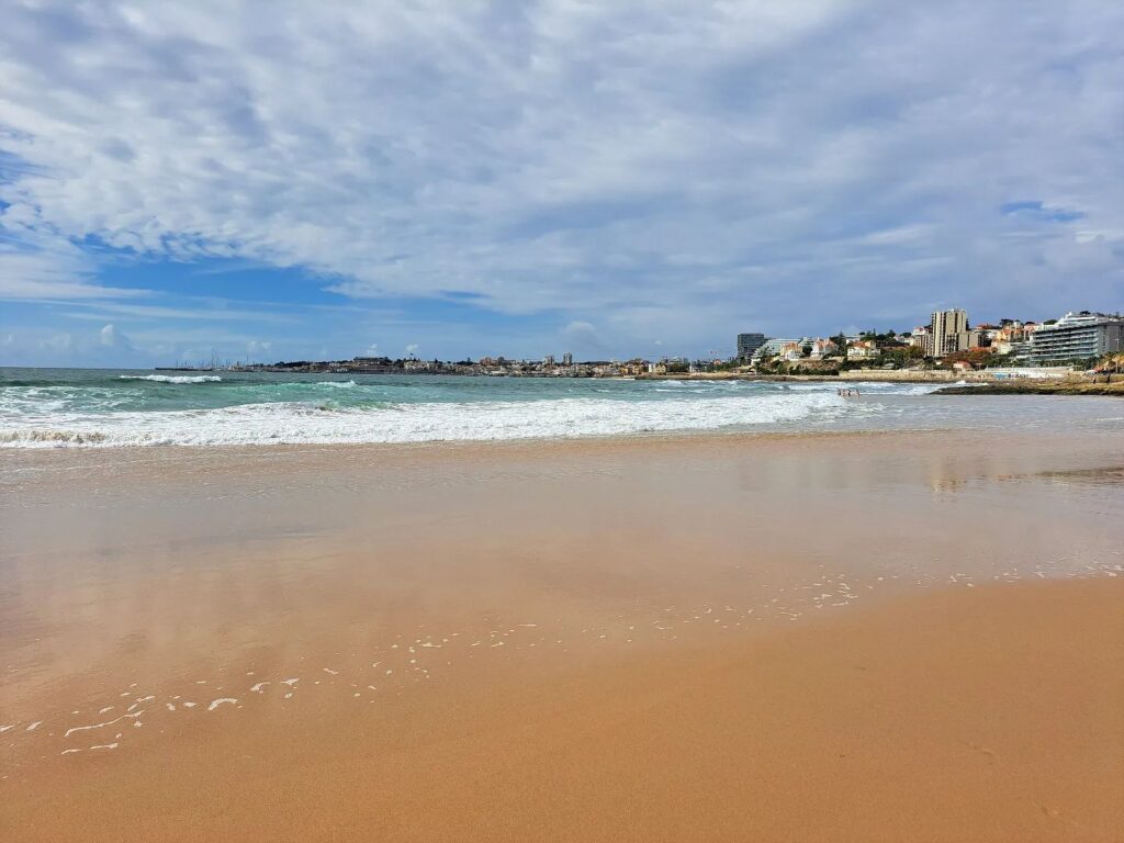 Beautiful Lisbon beach with golden sands and clear waters, perfect for relaxing and enjoying the sun. Discover top beaches in Lisbon for a memorable seaside experience.