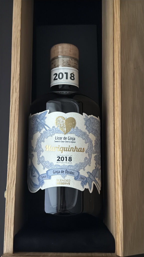 Handcrafted cherry liqueur bottle from LisboaVibes featuring artisanal Lisbon Grenà flavor, harvested in 2018, showcasing authentic Portuguese spirits and unique Lisbon food and drink culture.