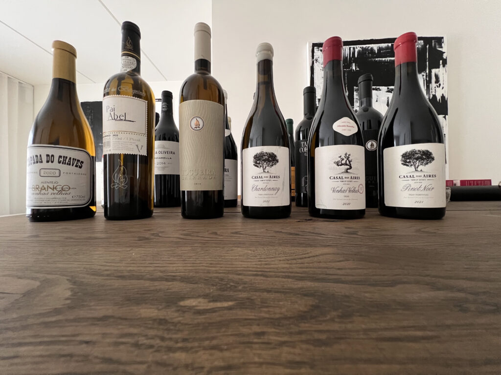 Bottles of Portuguese wine arranged on a wooden table in Lisbon.